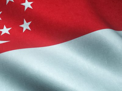 A closeup shot of the waving flag of Singapore with interesting textures